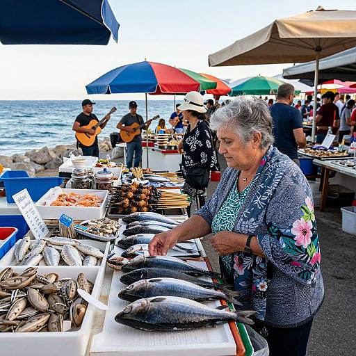 Photograph of an elderly woman with gray hair in a floral-patterned jacket, buying fish at a vibrant seaside market stall.