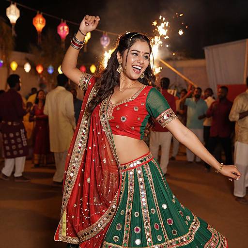 Photograph of a smiling Indian woman dancing at night, wearing a red and green traditional lehenga with gold embroidery, surrounded by colorful lanterns and a