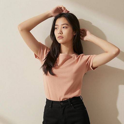 Young Asian Woman by Sunlit Wall