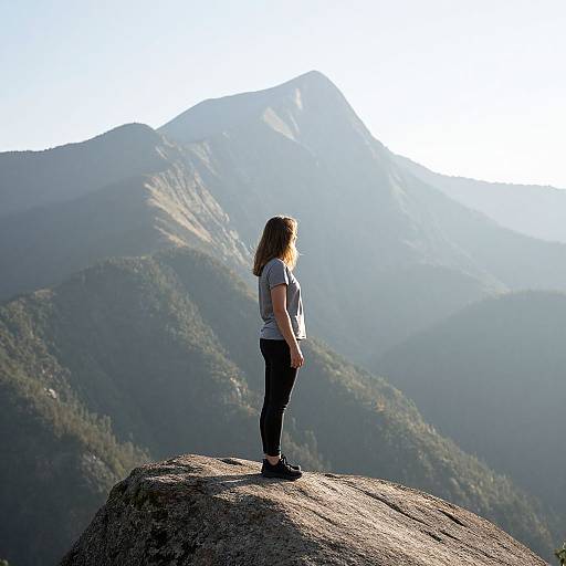 Woman on Rock by Mountain Daytime