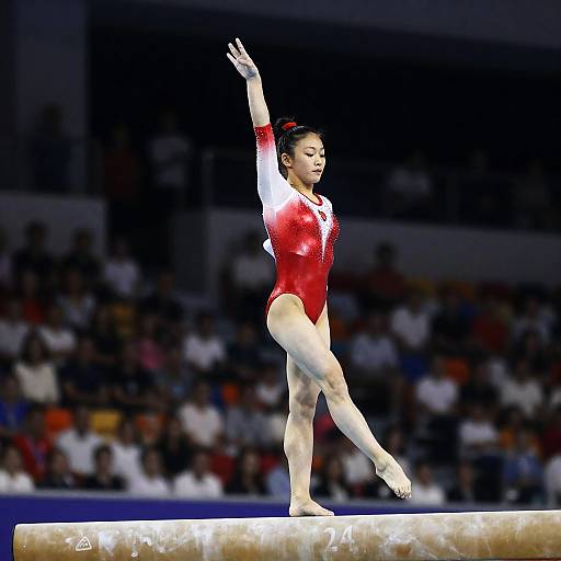 Female Gymnast Performing on Balance Beam