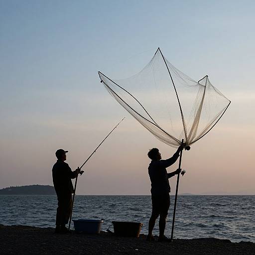 Silhouetted Fishermen Casting Nets