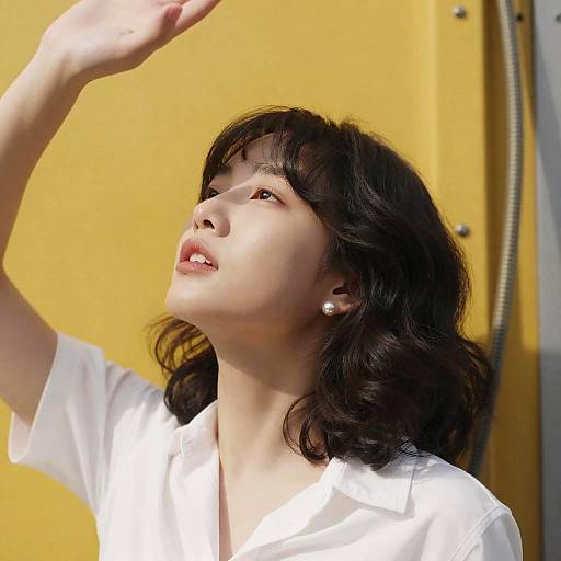 Candid Portrait of Woman Against Yellow Wall