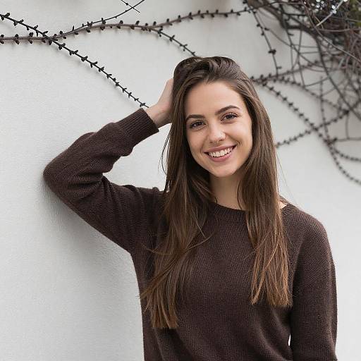 Smiling Young Woman with Brown Sweater