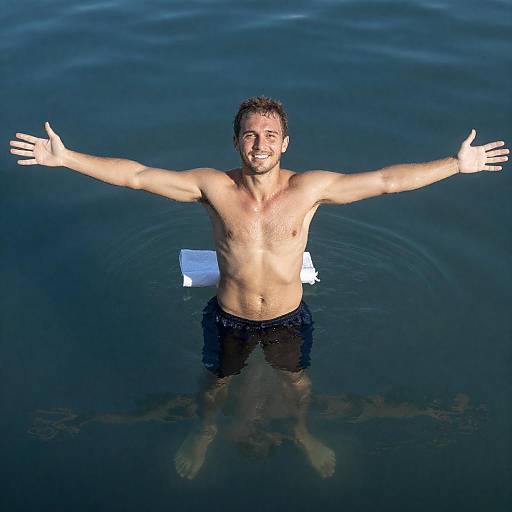 Smiling Shirtless Man Standing in Water