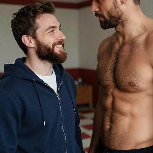 Bearded Man Smiling at Muscular Friend