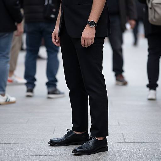 Man in Black Outfit on Sidewalk