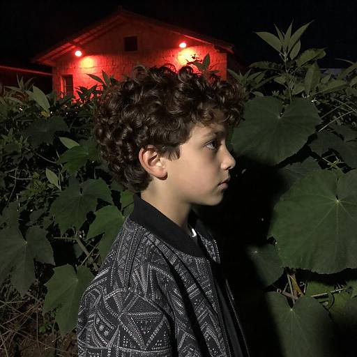 Intense Boy Portrait in Nighttime Setting