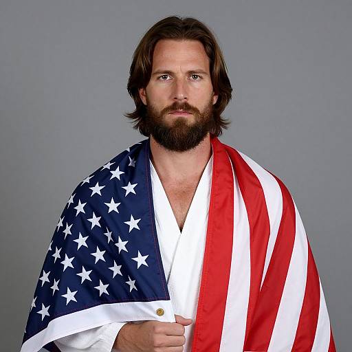 Serious Man Draped in American Flag