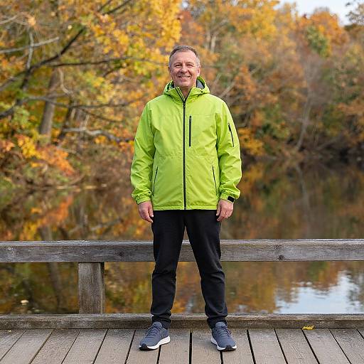 Cheerful Man on Autumn Bridge