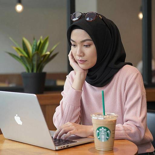 Asian Woman Working with Laptop and Coffee