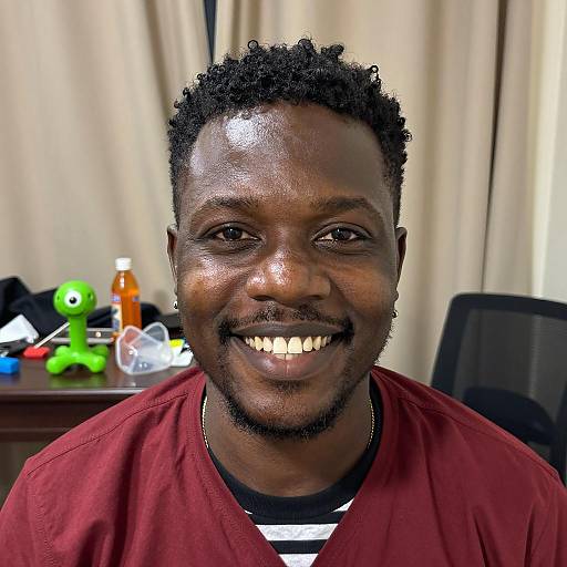 Smiling Black Man with Curly Hair Indoors