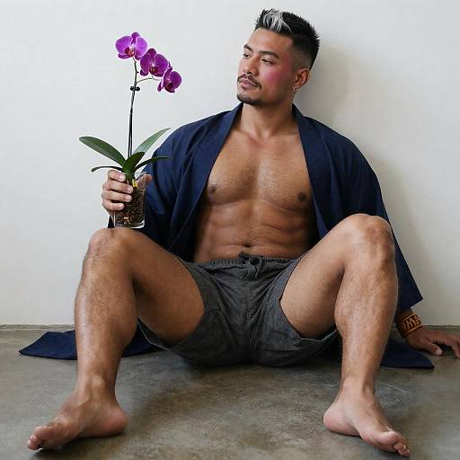 Muscular Dark-Skinned Man Reclining with Orchid