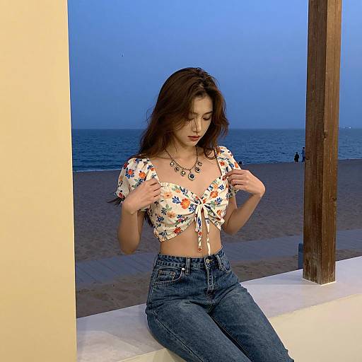 Woman on Ledge with Ocean View