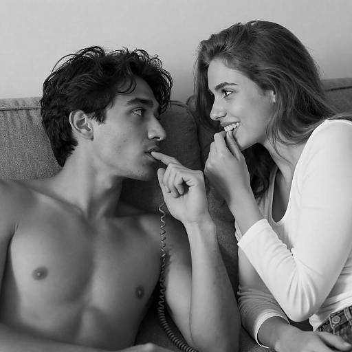 Playful Couple on Couch in Black and White