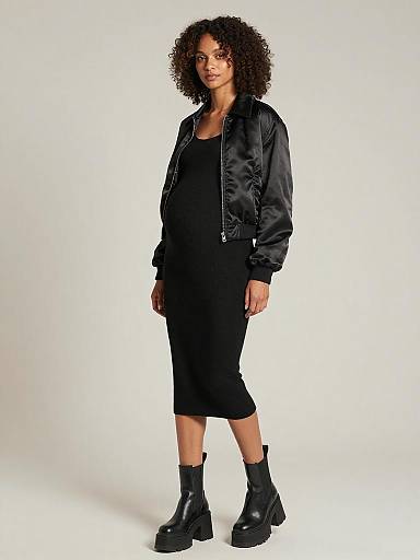 Sleek Monochrome Maternity Fashion Portrait