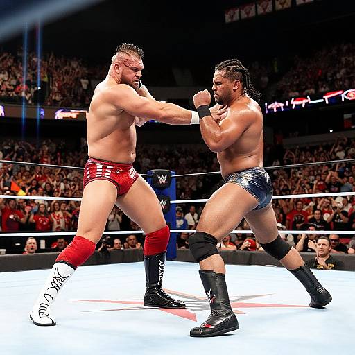 Photograph of two muscular male boxers in a ring; one in red trunks, the other in blue, exchanging punches in front of a cheering