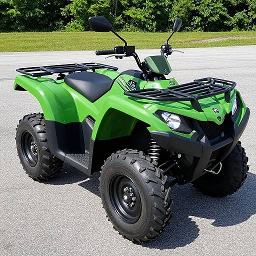 Photograph of a bright green, rugged all-terrain quad bike with large black tires, black seat, and black grille, parked on a sunny gravel