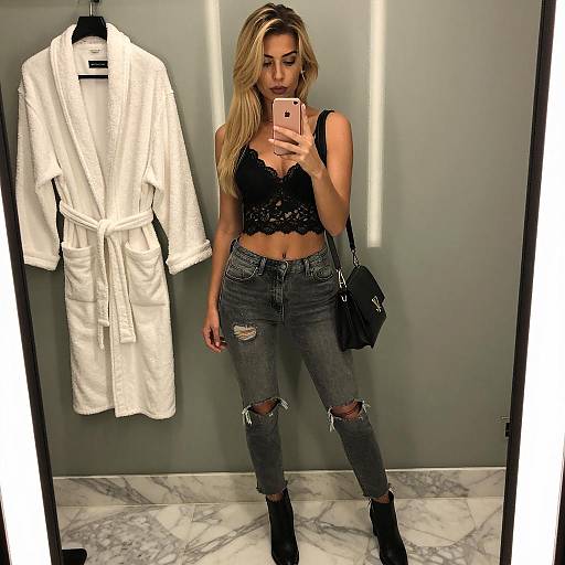 Blonde Woman Taking Mirror Selfie in Bathroom