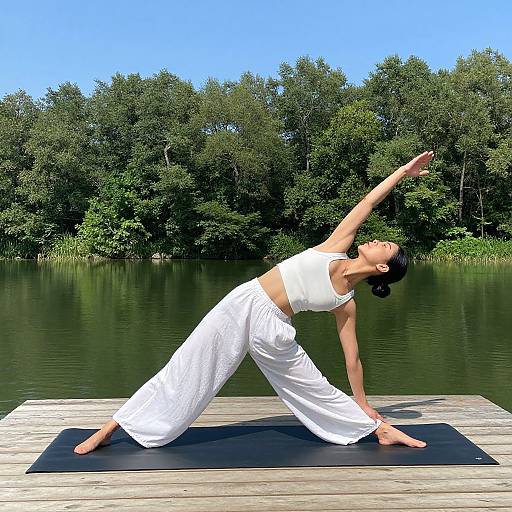 Woman Doing Yoga on Lakeside Dock