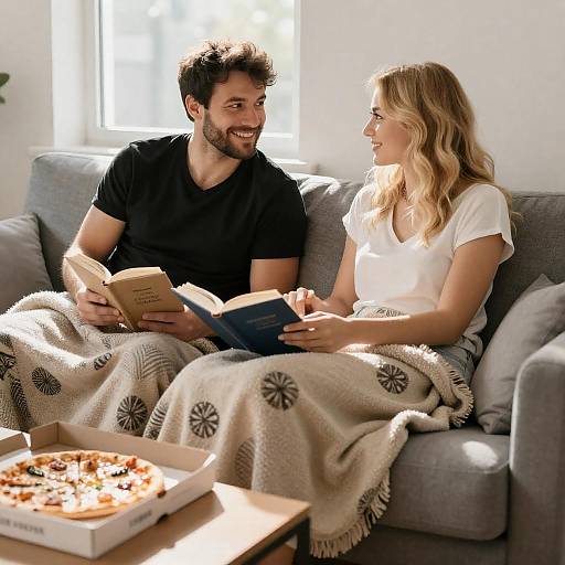 Sunlit Couple Reading on Gray Couch