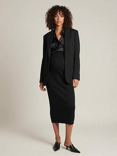 Sleek Monochrome Maternity Fashion Portrait