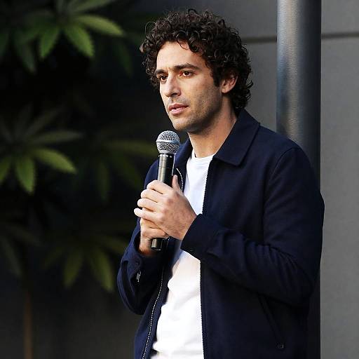 Man Speaking with Microphone Outdoors