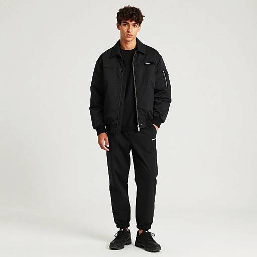 Confident Young Man in All-Black Streetwear