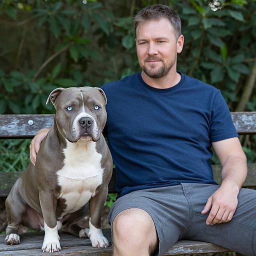Man and Blue-Eyed Pitbull Outdoors