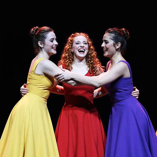 Three Women Dancing Embracing on Stage