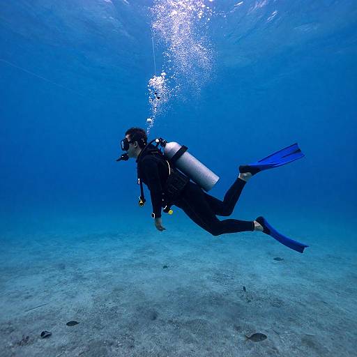 Scuba Diver Against Towering Underwater Wave
