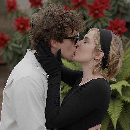 Passionate Kiss Amid Red Flowers