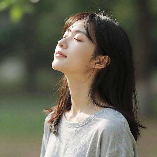 Sunlit Serenity: Woman with Closed Eyes