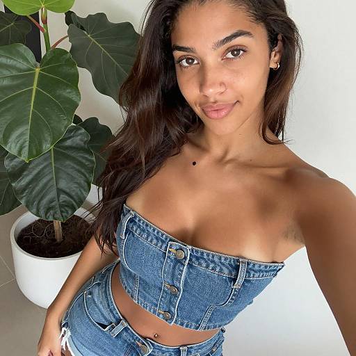 Smiling Woman Taking Denim Selfie Indoors