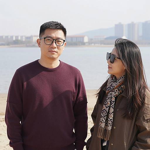 Couple on a Beach with Distant Cityscape