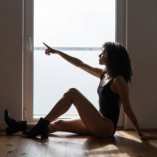 Curly-Haired Woman Silhouette by Door