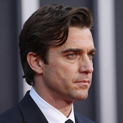 Man in Dark Suit with Intense Expression