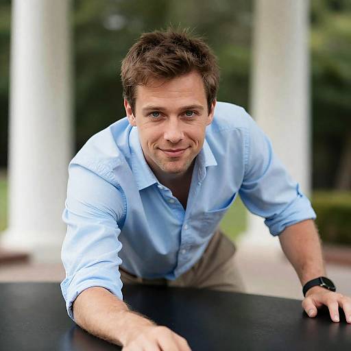 Man Leaning Forward on Black Surface