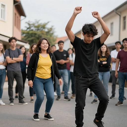 Young Man Dancing on Street with Crowd