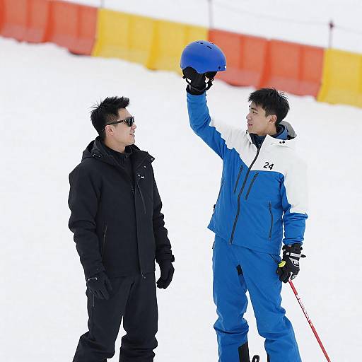 Two Men in Ski Gear on Snowy Slope