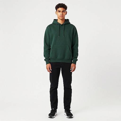 Young man in green hoodie and black pants