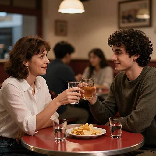 Dimly Lit Restaurant Toasting Moment