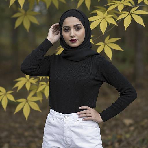 Young Woman in Black Hijab in Forest