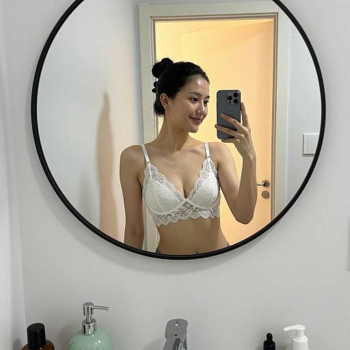 Woman Taking Mirror Selfie in White Lace Bra