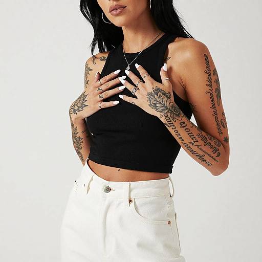 Tattooed Woman in Stylish Monochrome Outfit