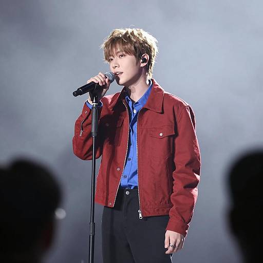 Male Singer Center Stage in Fog