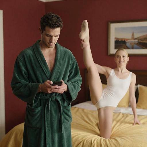 Man in Robe with Phone and Woman Stretching in Bedroom