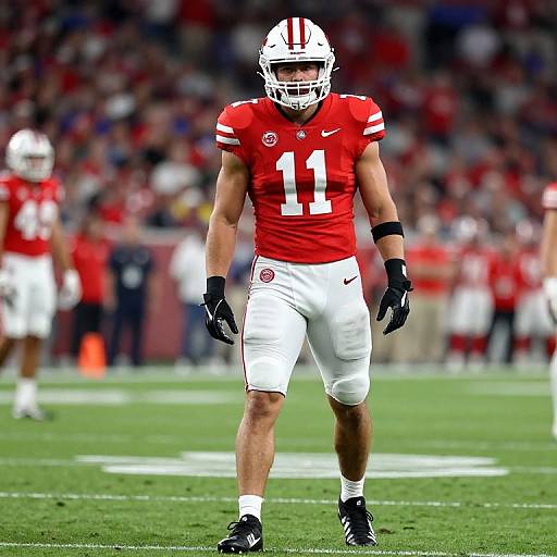 Muscular Football Player in Red Uniform