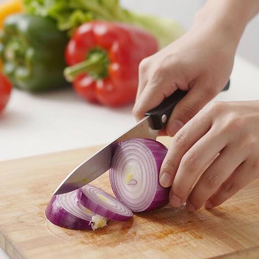 Close-Up of Hands Slicing Onion