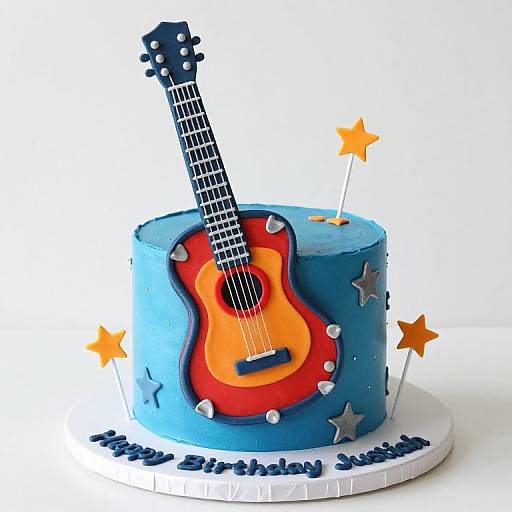 Photograph of a blue guitar-shaped cake with a red and orange body, silver frets, and orange stars on a white base.